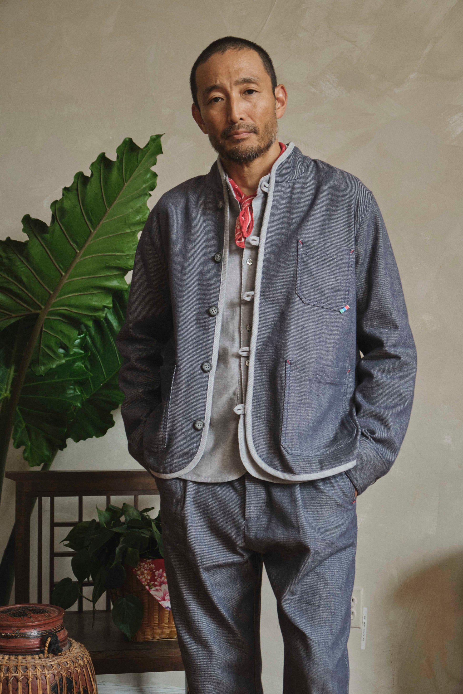 Model wearing Japanese denim Tang chore jacket, front view