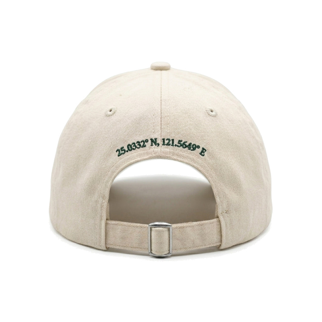 Beige cap with embroidered coordinates on a white background
