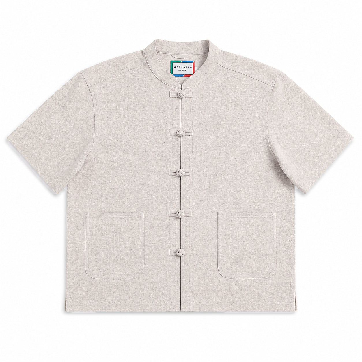 A light beige short-sleeve mandarin collar shirt with five front toggle closures and two front patch pockets, shown flat on a white background.