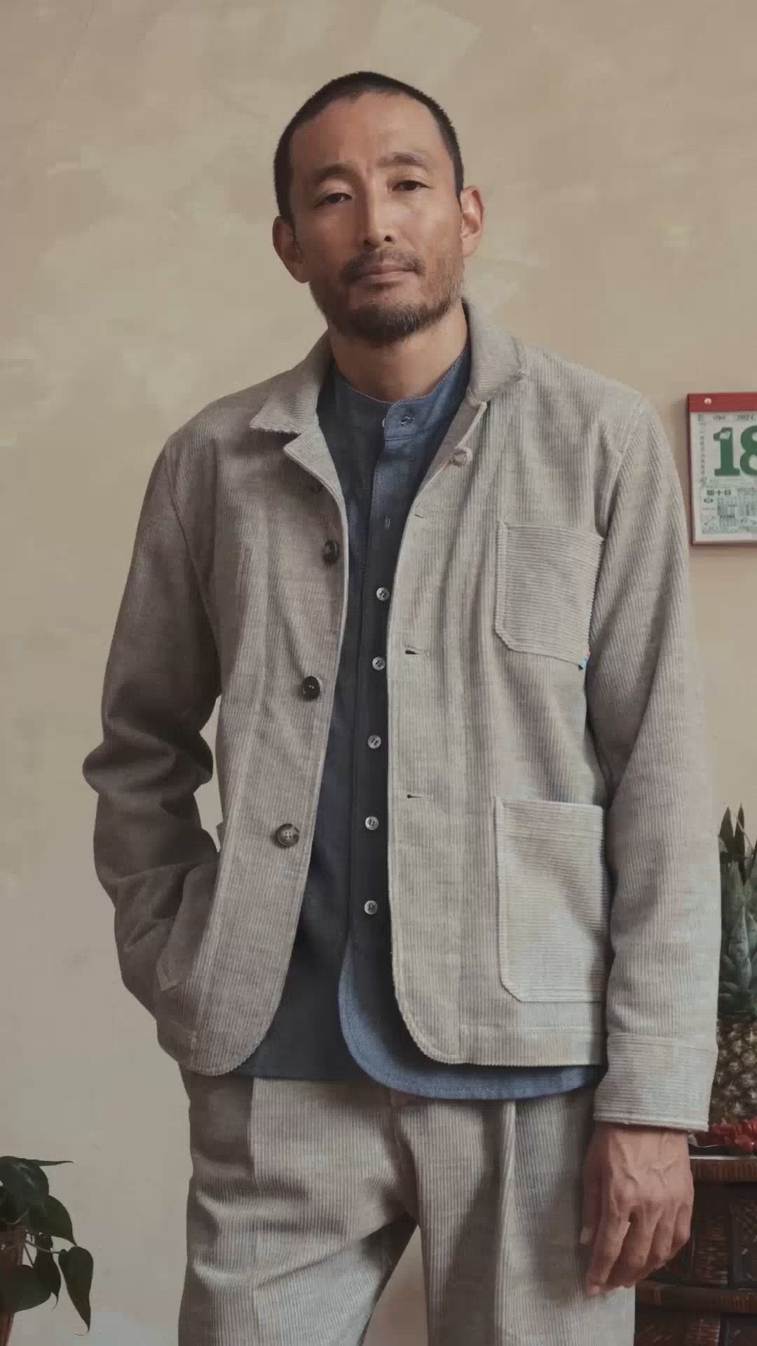 Model wearing grey heather corduroy chore jacket, front view