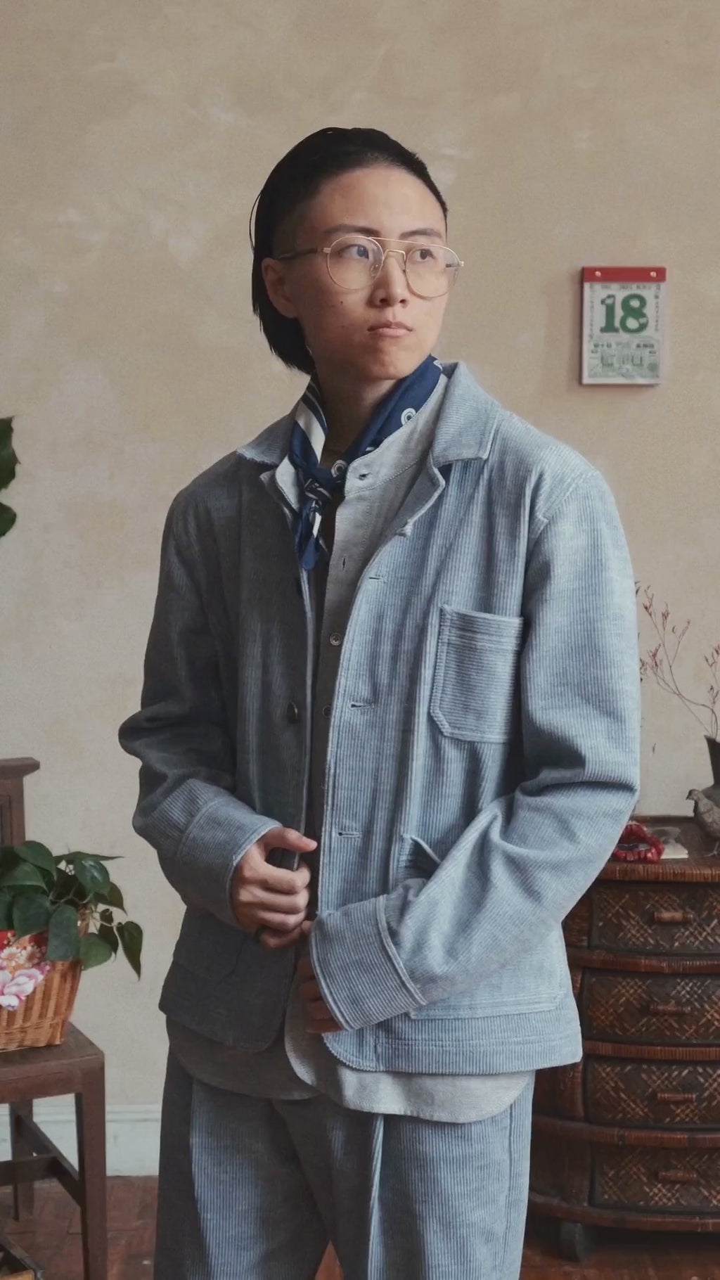 Model wearing blue heather corduroy chore jacket, front view