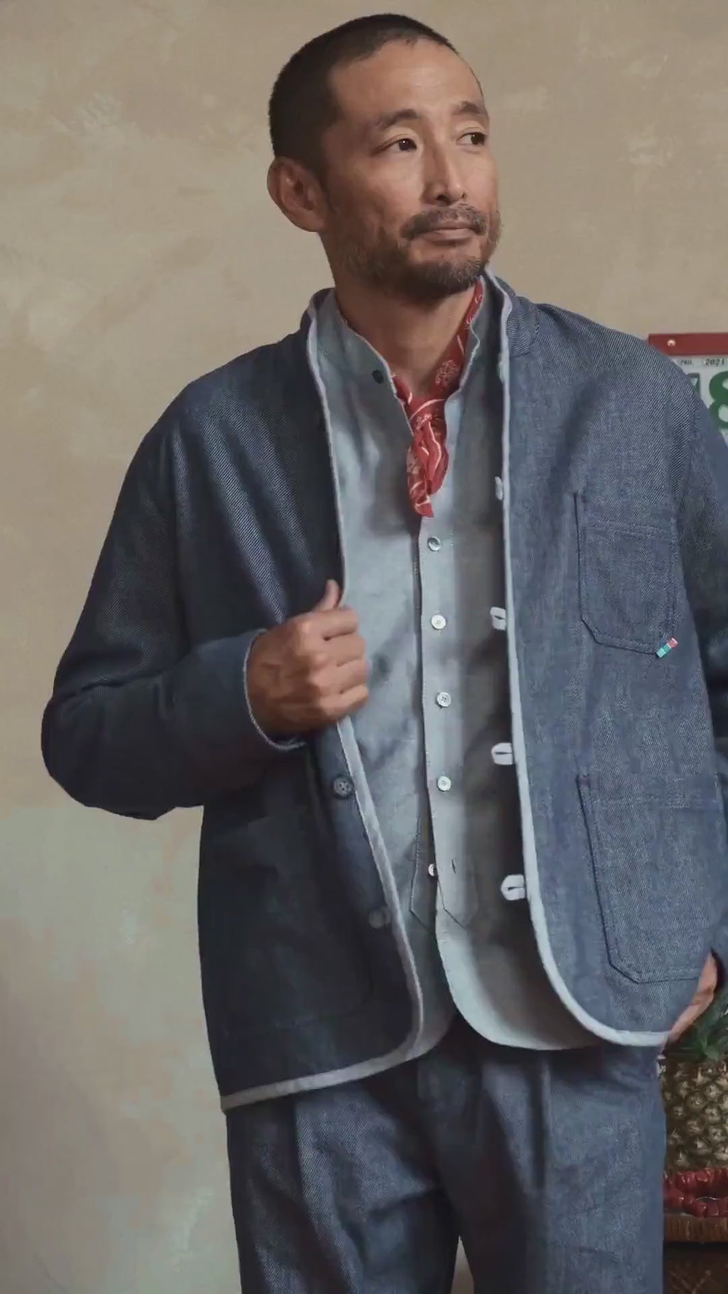 Model wearing Japanese denim Tang chore jacket, front view